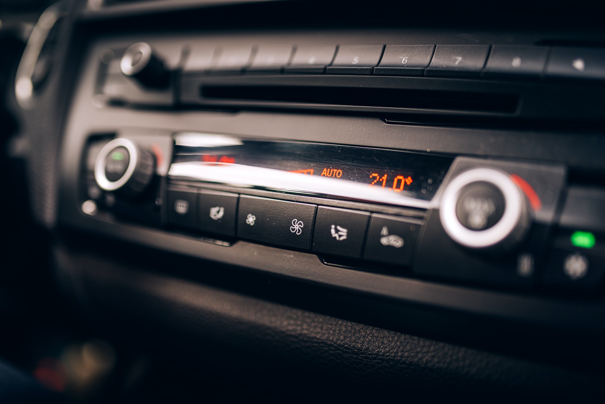 Car clima controls, radio dashboard and cockpit close up
